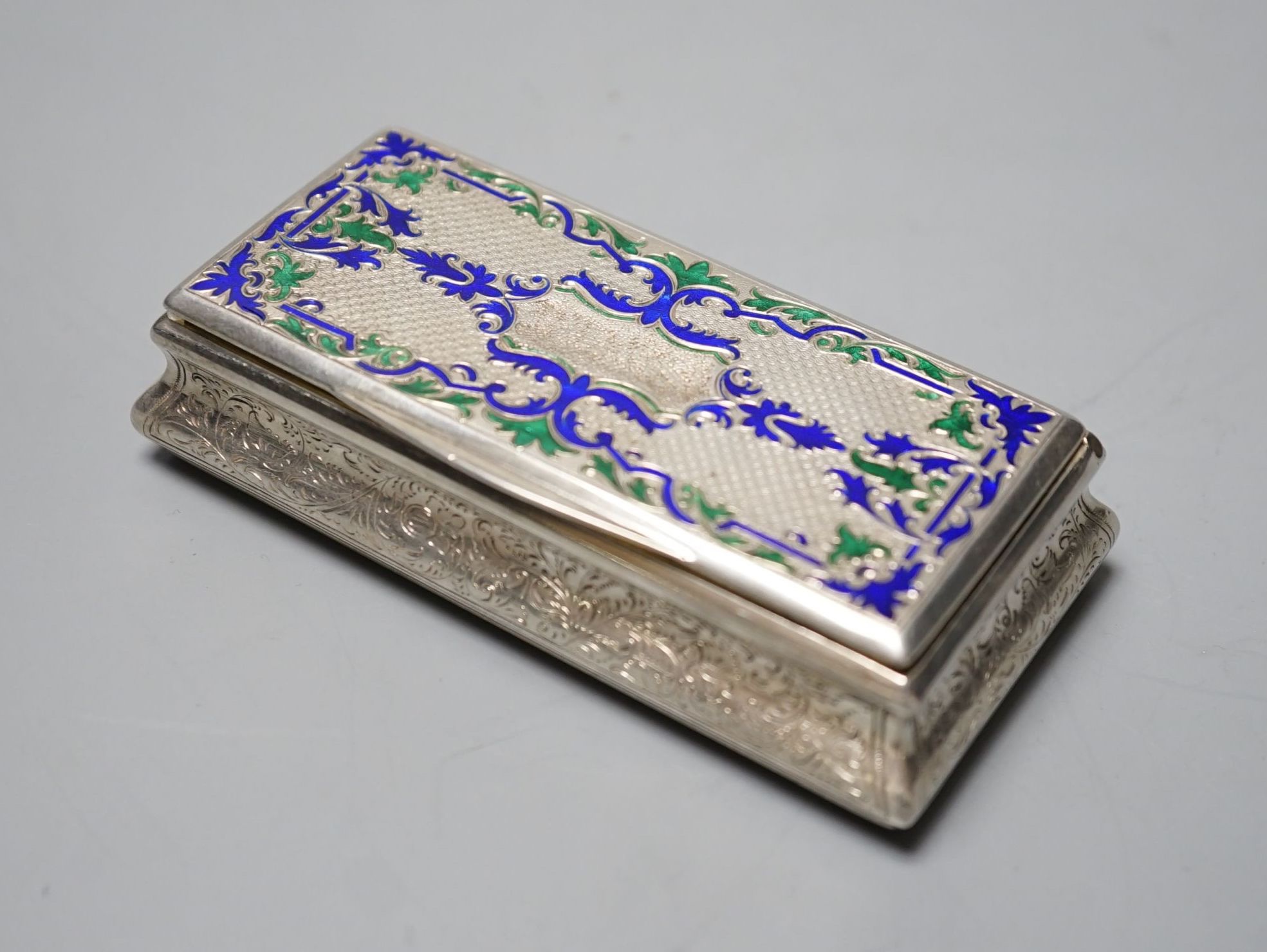 A 19th century Austro-Hungarian white metal and two colour enamel snuff box, with interior engraved inscription, 92mm, gross weight 98.2 grams.